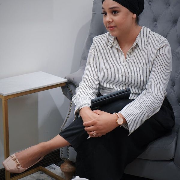 A cozy corner with a yoga mat, a plant, and a cup of tea.